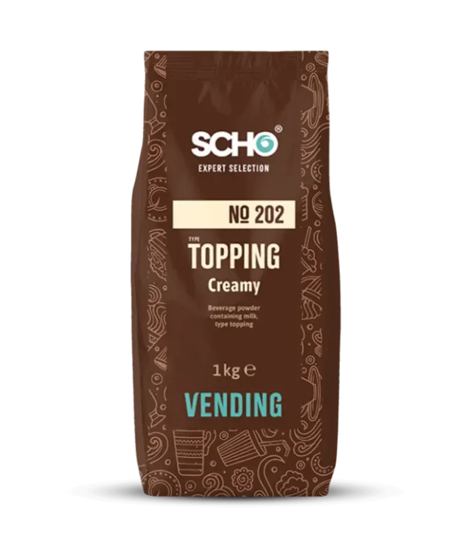 En 1 kg pakke med Schokinag "the topping creamy" drikkepulver, designet for salgsautomater, med brunt og rødt fargevalg.