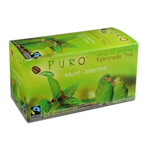 Eske med puro fairtrade myntete med et bilde av grønne papegøyer og en regnskogbakgrunn. inneholder 25 teposer.