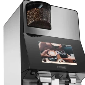 Wittenborg w100 kaffemaskin er en moderne kaffemaskin med berøringsskjerm, doble dispensere og et synlig kaffebønnekammer på toppen.