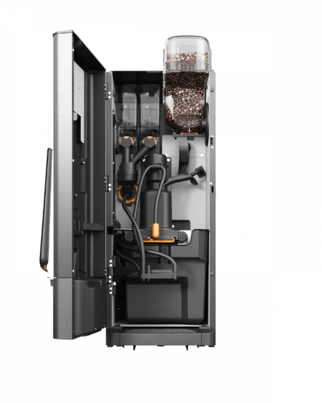 Åpen kaffemaskin som viser innvendige komponenter, inkludert et rom fylt med kaffebønner, slanger og mekaniske deler. Sidepanelet åpnes for å vise den innvendige layouten.