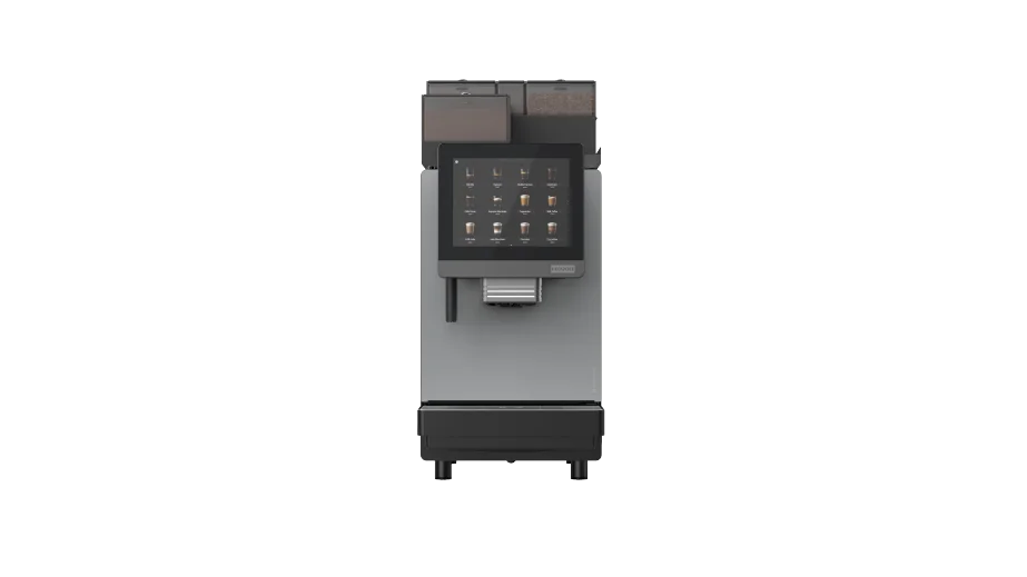 En kommersiell automatisk kaffemaskin med berøringsskjerm, flere ikoner for valg av drikkevarer og en utløper nederst, avbildet mot en ensfarget hvit bakgrunn.