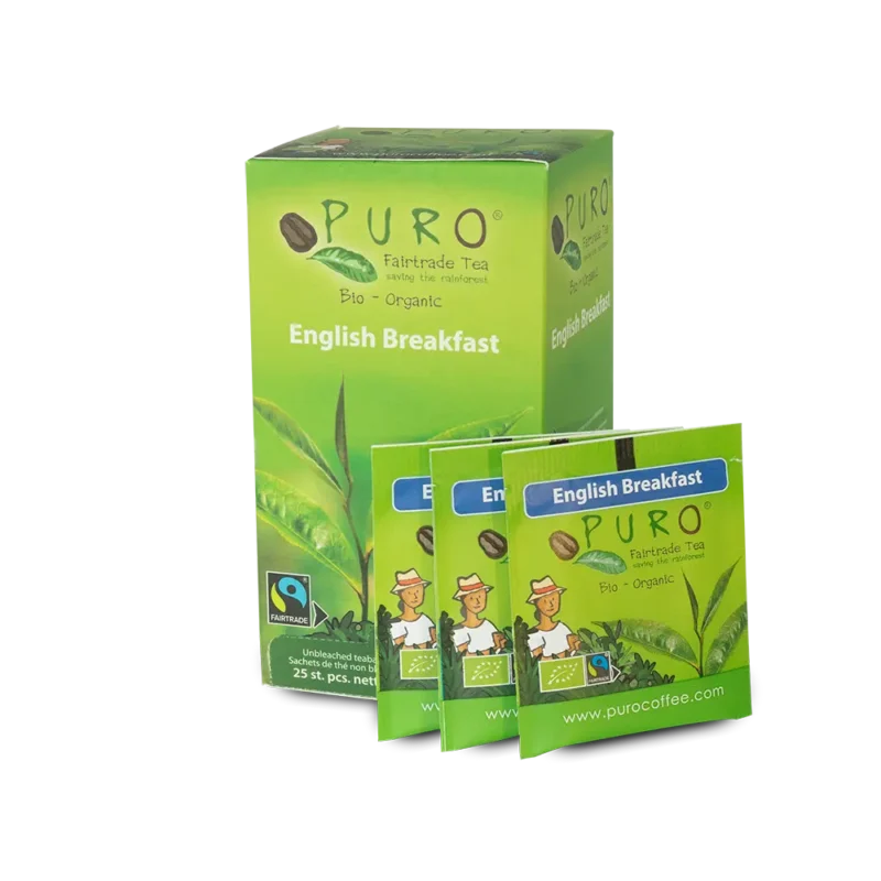 En boks med Puro Fairtrade økologisk engelsk frokostte med tre individuelle teposer utstilt foran. Emballasjen er grønn med illustrasjoner av arbeidere og teblader.